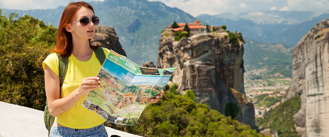 beautiful tourist greece with meteora monasteries background