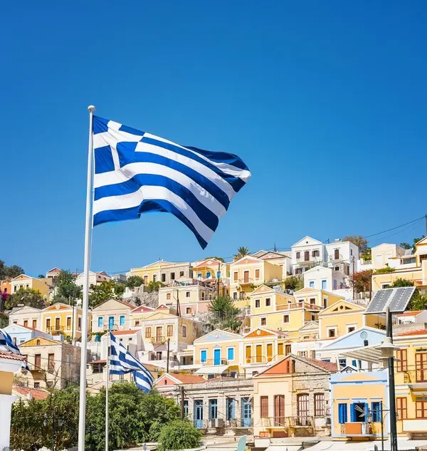 greek flags boats colorful neoclassical houses harbor town symi island greece 138689646